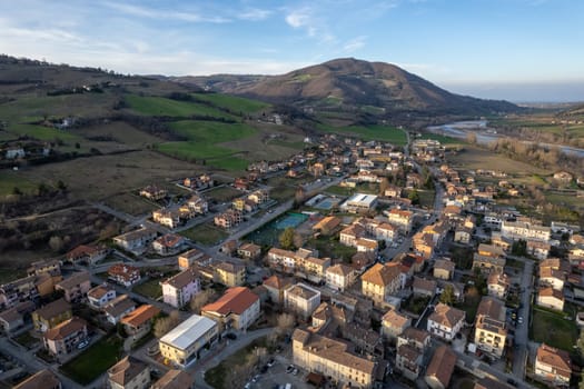Aerial scenic view of Travo Village, Trebbia river, Valley landscape, Piacenza Italy at sunset