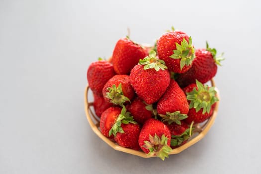 strawberries in a wicker plate.
