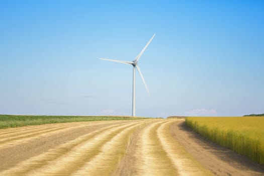 Windmills near the field of flax Normandy, France