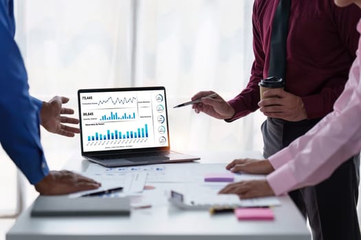 Close up of Diverse colleagues gather brainstorm discuss financial statistics at office meeting. finance, teamwork, Big data Graphs Charts concept.