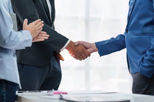 Business partnership meeting concept. Image business people handshake. Successful businessmen handshaking after good deal. Group support concept.