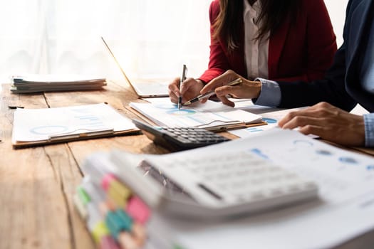 Business team collaboration discussing working analyzing with financial data and marketing growth report graph in team, presentation and brainstorming to strategy planning making profit of company.