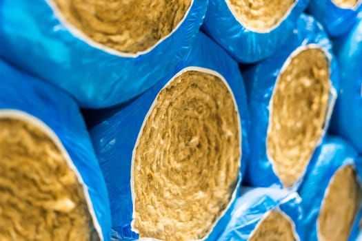 Package of thermal insulation material, rock wool is wrapped in a foil.