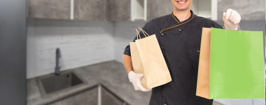 Diverse of paper containers for takeaway food. Delivery man is carrying pizza.