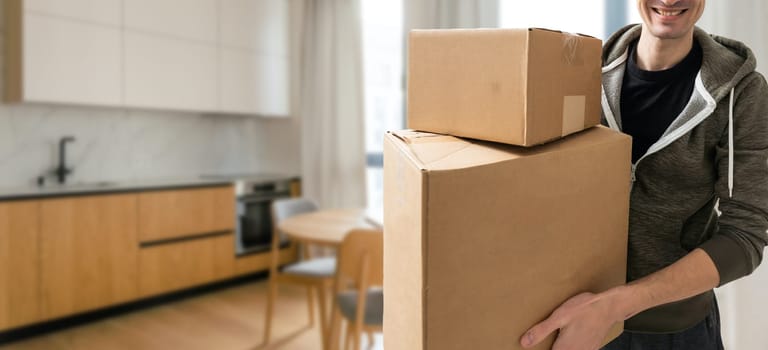 man moving to a new home with box.