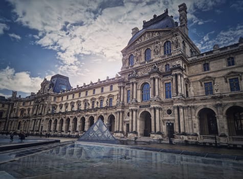 Outdoors view to the Louvre Museum in Paris, France. The historical palace building