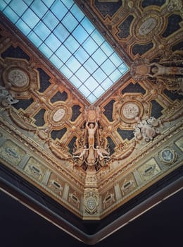 Ceiling architectural details of the Salon Carre inside Louvre museum, Paris, France