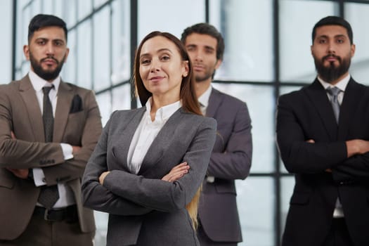 Happy diverse business people office workers team standing in row looking at camera.