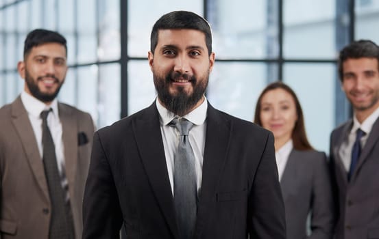 Group portrait of four successful young business people. Team of 4 happy confident businesspeople in smart office wear