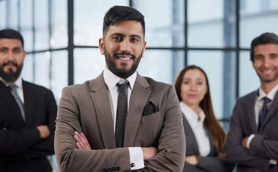 Business team standing in office and look at camera