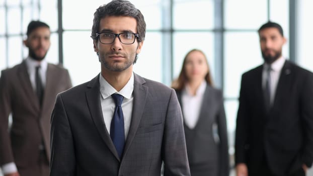 successful startup founder, corporate employee with staff members portrait