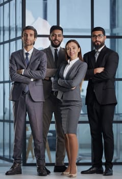 a group of different business people in an office lobby.