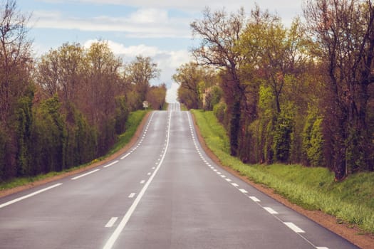 Traveling on a rural french country road in spring