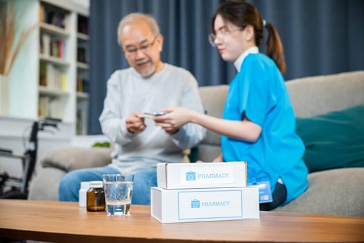Woman nurse caregiver show prescription drug to senior man at nursing home, Doctor with physician visit senior male patient consult medicine dosage at house in living room, Healthcare worker support