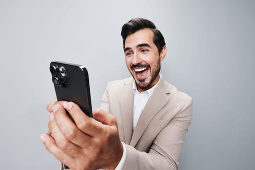 man phone entrepreneur cyberspace call confident business technology phone gray beard portrait smartphone suit mobile adult businessman hold internet smile lifestyle happy