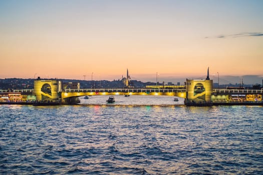 Beautiful sunset aerial cityscape of Istanbul historic centre with Galata bridge and mosques. Istanbul, Turkey.