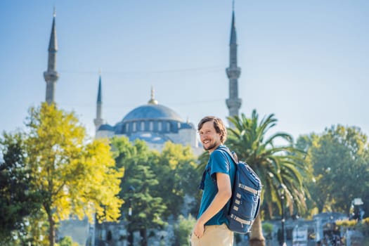 Man tourist enjoying the view Blue Mosque Sultanahmet Camii Istanbul, Turkey.