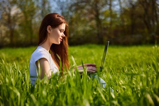 woman with laptop outdoors. High quality photo