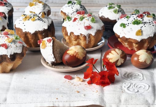 The concept of delicious Easter food, close up.Easter baking with eggs on a white wooden table.