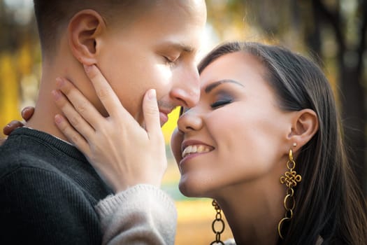 Close-up portrait of young couple in love autumn outdoor outdoor.