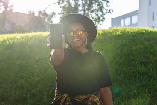 African american woman talking phone in the city - communication