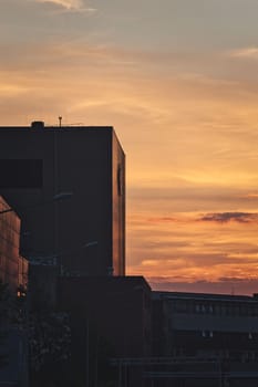 Vertical aesthetic sunset over the buildings in Muenster, NRW, Germany