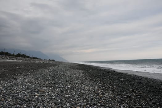 Black and rocky beach at the coast in Xincheng Township, Taiwan