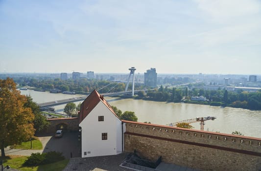 Slovakia, Bratislava - October 8, 2022: Top view of the Bratislava Castle and the Danube River. High quality photo