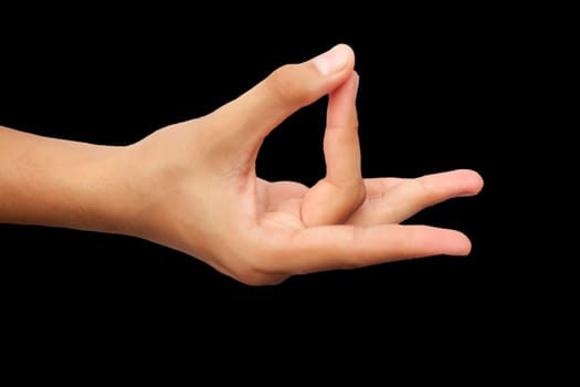 Shot of a male hand demonstrating Aakash Mudra isolated on black background.