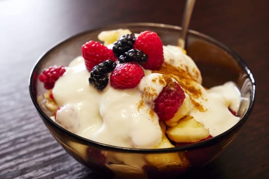 Fresh delicious fruit salad on the table close up