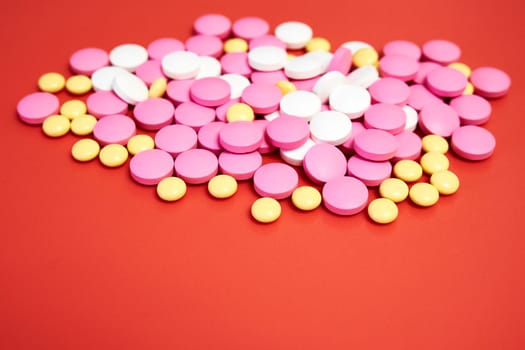 Scattered colorful tablets. Multicolored pills without packaging