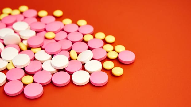 Scattered colorful pills. Multicolored pills without packaging
