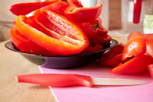 Sliced red pepper in a plate close-up. Selective Focus