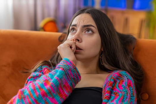 Sad lonely woman lying at home room looks pensive thinks over life concerns, unrequited love suffers from unfair situation. Caucasian alone girl problem break up, depressed feeling bad annoyed burnout
