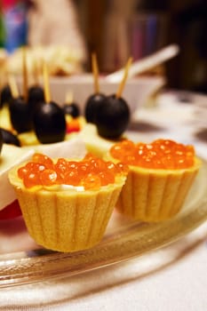 Tartlets with red caviar close-up. Seafood and their health benefits. Selective focus