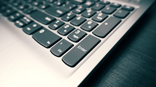 Laptop keyboard. Close-up of modern laptop keyboard. Selective focus