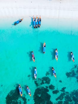 Longtail boats in the blue ocean of Koh Lipe Island Southern Thailand