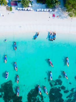 Longtail boats in the blue ocean of Koh Lipe Island Southern Thailand