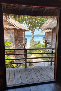 Koh Lipe Island Southern Thailand view from the window with turqouse colored ocean and white sandy beach at Ko Lipe.