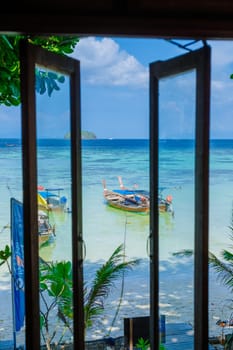 Koh Lipe Island Southern Thailand view from the window with turqouse colored ocean and white sandy beach at Ko Lipe.