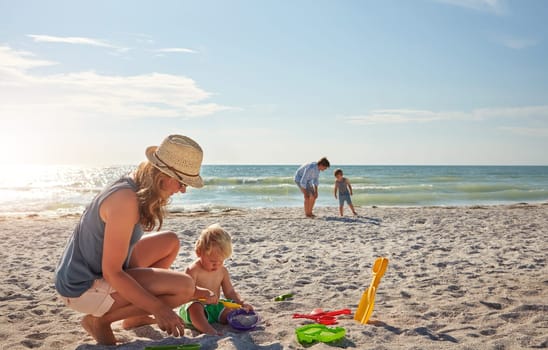 Summer days were made for the beach. a young family enjoying a summer day out at the beach