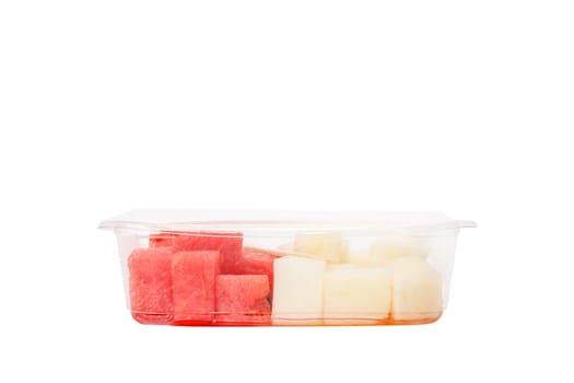 Fruit salad with watermelon and melon in a plastic container on a white background. High quality photo
