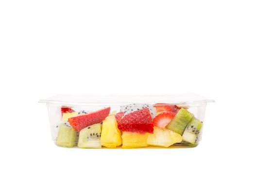 Fruit salad of pineapple, strawberry, kiwi and pitahaya in a plastic container on a white background. High quality photo