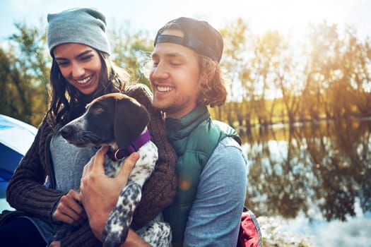 The best part of this campsite is that its pet-friendly. a loving couple on a camping trip