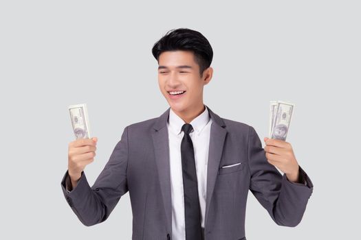 Young asian business man holding money dollar isolated on white background, businessman in suit holding banknote and success and excited with finance, savings and investment, income and spending.