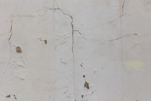 shabby dry white plaster under direct sunlight texture and full frame background