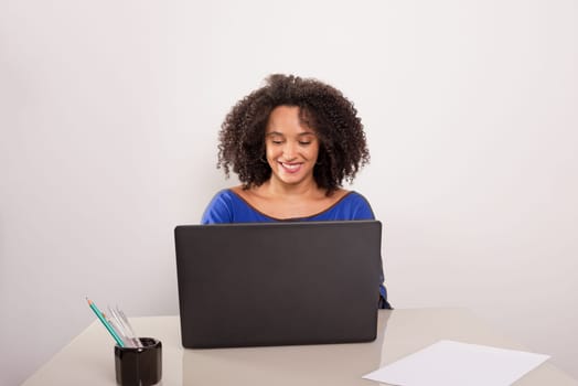 Young pretty businesswoman working with laptop. Home office. isolated on white background