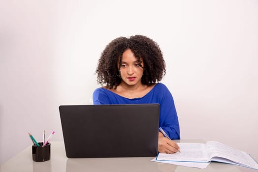 Young pretty businesswoman working on her laptop. Confident ceo concept.