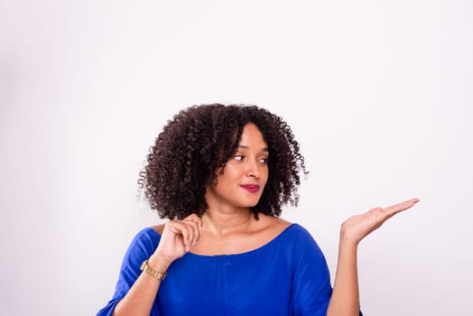 Young businesswoman in her home office making hand gestures. Isolated on white background.