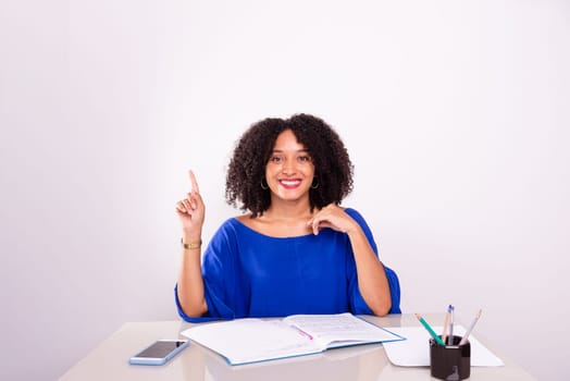 Young businesswoman in her home office making hand gestures. Isolated on white background.